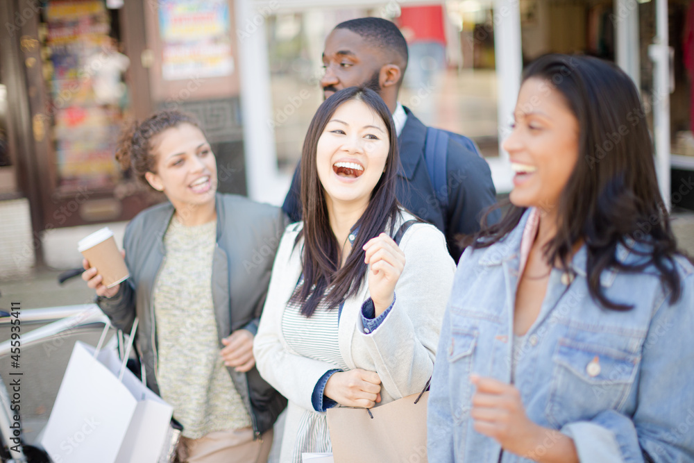Smiling friends with coffee and shopping bags Smiling friends with coffee and shopping bags