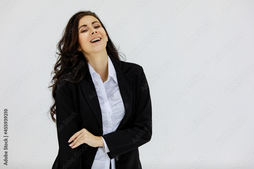 Isolated portrait studio shot of Caucasian proud pretty smart professional success female businesswoman officer in black formal suit standing smiling and look at camera on white background Isolated portrait studio shot of Caucasian proud pretty smart professional success female businesswoman officer in black formal suit standing smiling and look at camera on white background