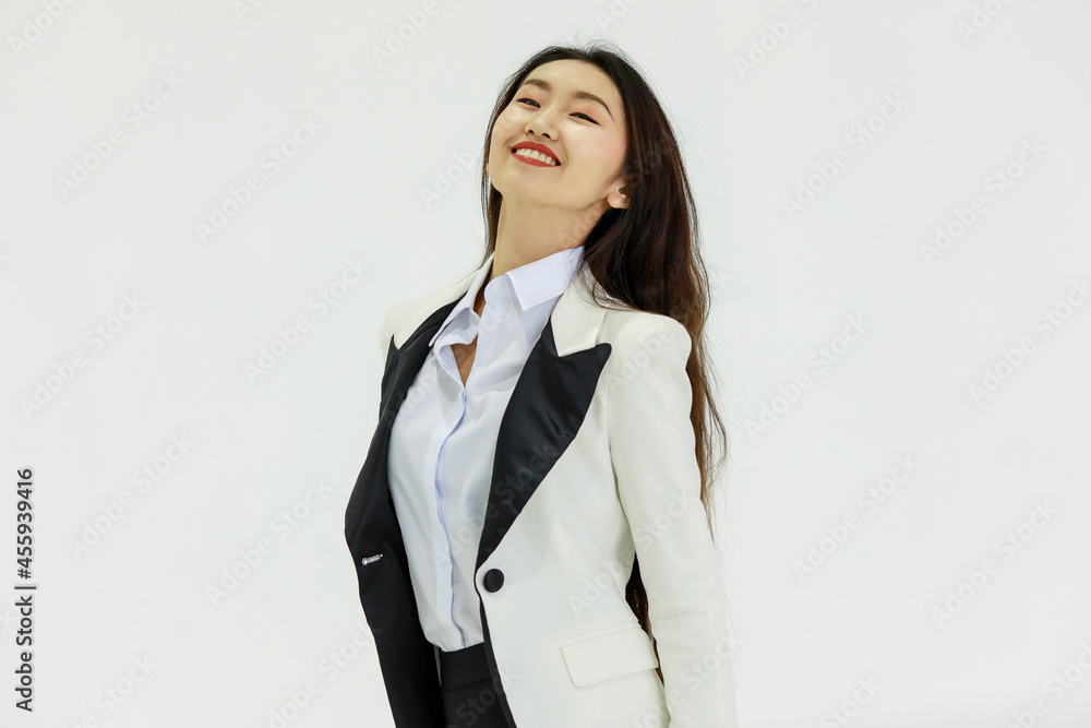 Isolated portrait studio shot of Asian happy confident professional arrogant female businesswoman in business formal suit standing smiling posing crossed arms look at camera on white background Isolated portrait studio shot of Asian happy confident professional arrogant female businesswoman in business formal suit standing smiling posing crossed arms look at camera on white background