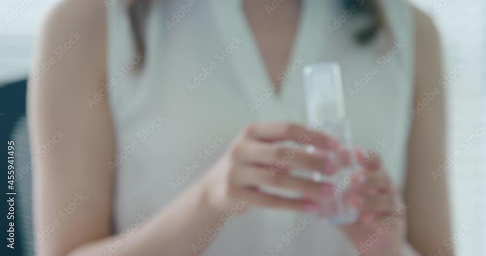 Young businesswoman using disinfectant in office,4K Young businesswoman using disinfectant in office,4K