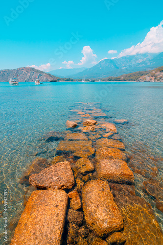 Fototapeta Naklejka Na Ścianę i Meble -  Ruins of the wall in the beach in Phaselis ancient city in Antalya Turkey