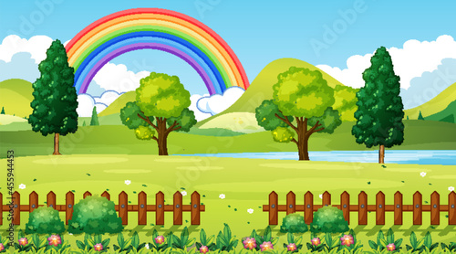 Nature park scene background with rainbow in the sky