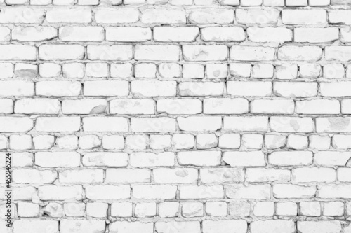 White old rough shabby brick wall texture. Whitewashed masonry. Abstract light grey grunge background