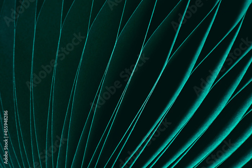 Dark green abstract background, fragment of paper decoration close-up