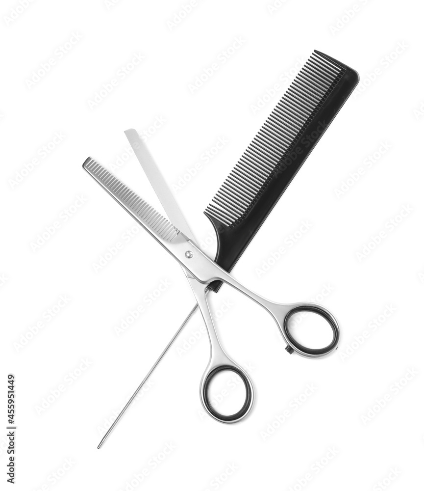 New thinning scissors and comb on white background, top view. Professional tool for haircut New thinning scissors and comb on white background, top view. Professional tool for haircut