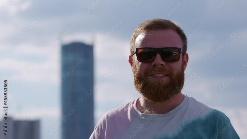 Close up of cheerful male with red beard looking to camera and smiling. Portraits. Concept of people and emotions Close up of cheerful male with red beard looking to camera and smiling. Portraits. Concept of people and emotions