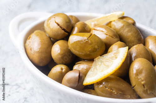 Cracked green olives. Crack...