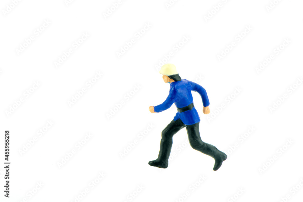 Miniature people engineer worker construction concept on white background with a space for text Miniature people engineer worker construction concept on white background with a space for text