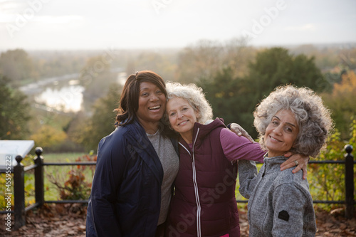 Active senior women friends in autumn park