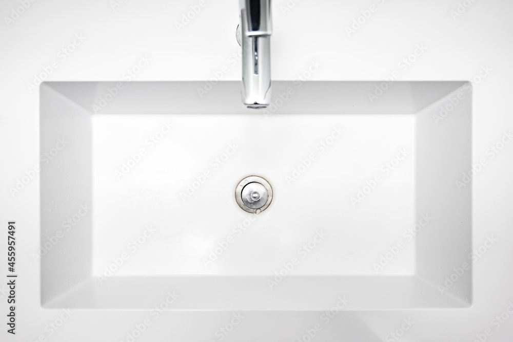 Bathroom interior with top view of sink and faucet. Bathroom interior with top view of sink and faucet.