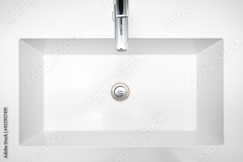 Bathroom interior with top view of sink and faucet.
