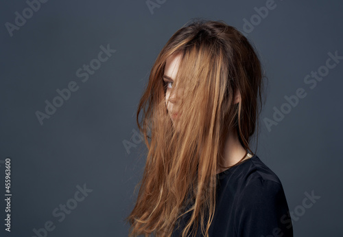 pretty woman fashion hairstyle glamor posing dark background