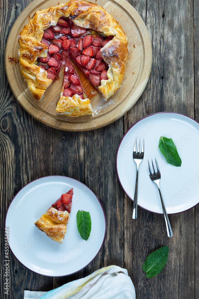 tart with strawberries on a wooden table. Copy space, top view. tart with strawberries on a wooden table. Copy space, top view.