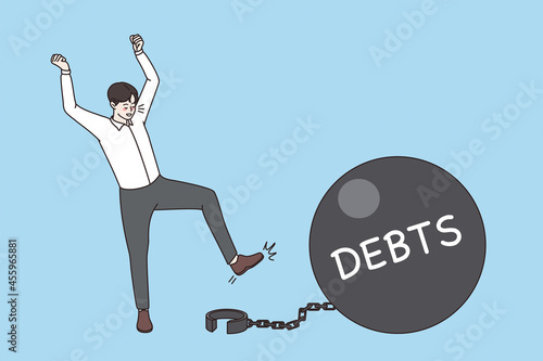 Financial success and wealth concept. Happy businessmen standing using key to unlock chain from debt time bomb vector illustration 