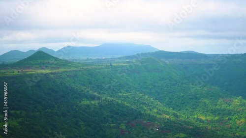 View of the clouds above the Sahyadri Mountain Range as seen from Saputara Table Point at Saputara in Gujarat, India. Nature background. Clouds above the hills during the monsoon season.  photo