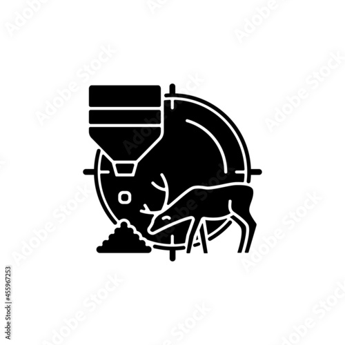 Bait hunting black glyph icon. Expose feed and stalk waterfowl and mammals. Attract and lure wild animals to take them. Capture prey. Silhouette symbol on white space. Vector isolated illustration
