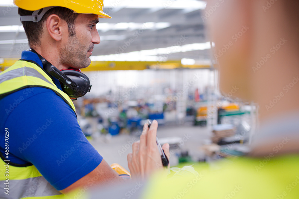 Portrait confident worker in steel factory Portrait confident worker in steel factory