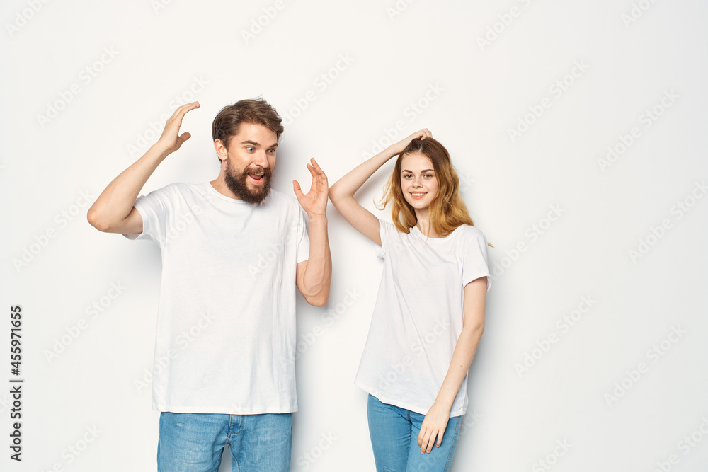 young couple in white t-shirts and jeans casual wear fashion mockup young couple in white t-shirts and jeans casual wear fashion mockup
