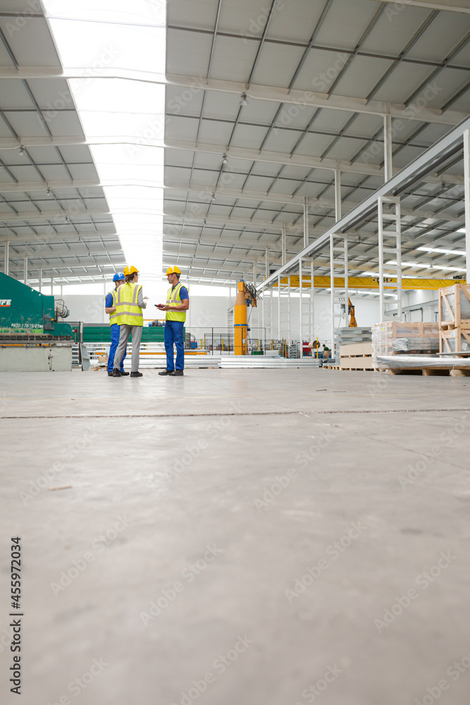 Supervisor and workers talking in warehouse Supervisor and workers talking in warehouse