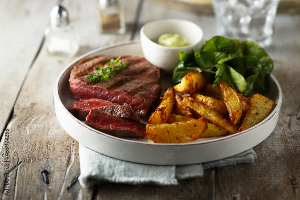 Beef steak with roasted potato and salad Beef steak with roasted potato and salad