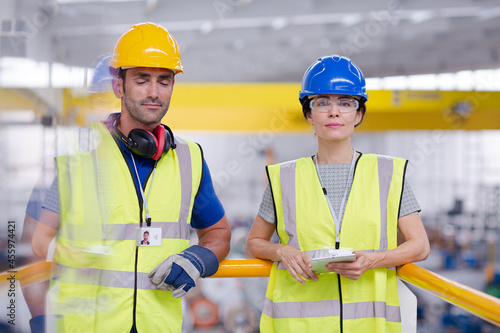 Supervisor and worker in steel factory