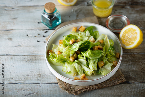 Traditional Caesar salad with bread croutons photo