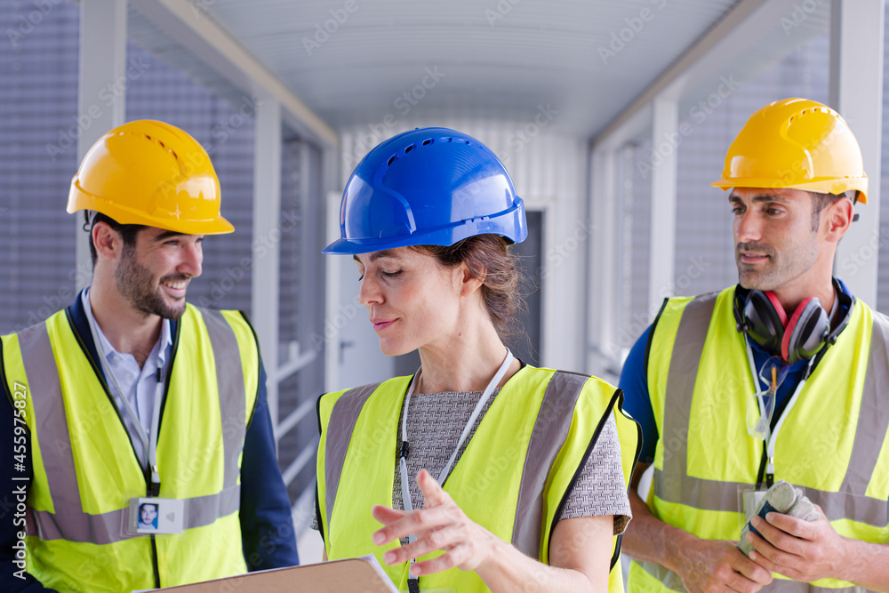 Supervisors and worker with clipboard in factory Supervisors and worker with clipboard in factory