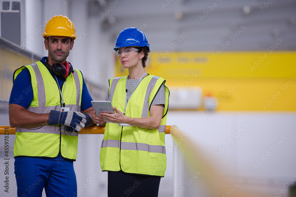Supervisor and worker in steel factory Supervisor and worker in steel factory
