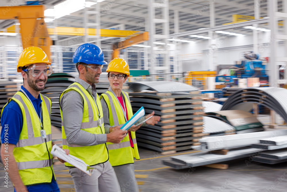 Supervisor and workers talking in warehouse Supervisor and workers talking in warehouse