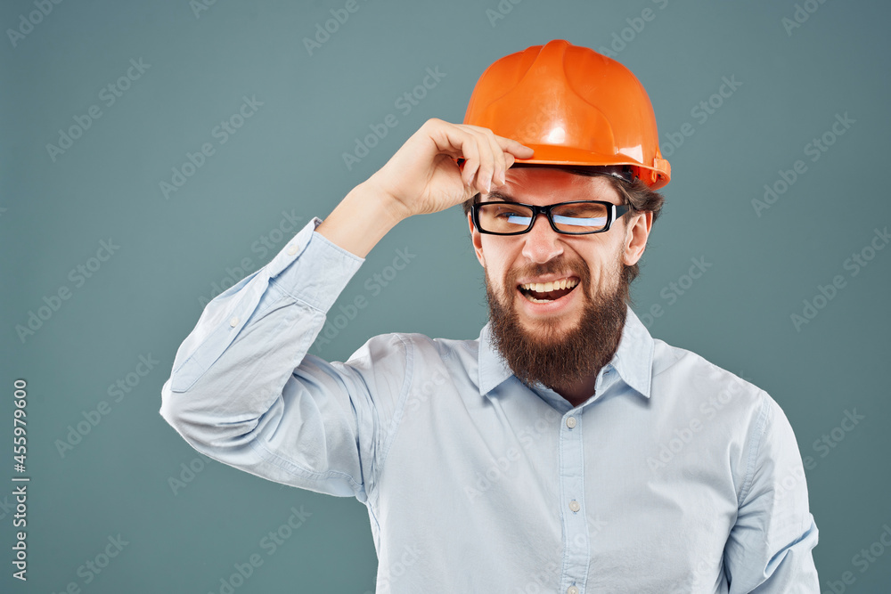 male engineer orange helmet on the head Studio hand gesture male engineer orange helmet on the head Studio hand gesture