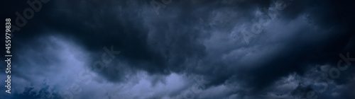 Heavy gray storm clouds. Gloomy sky background for design. Web banner. Website header.