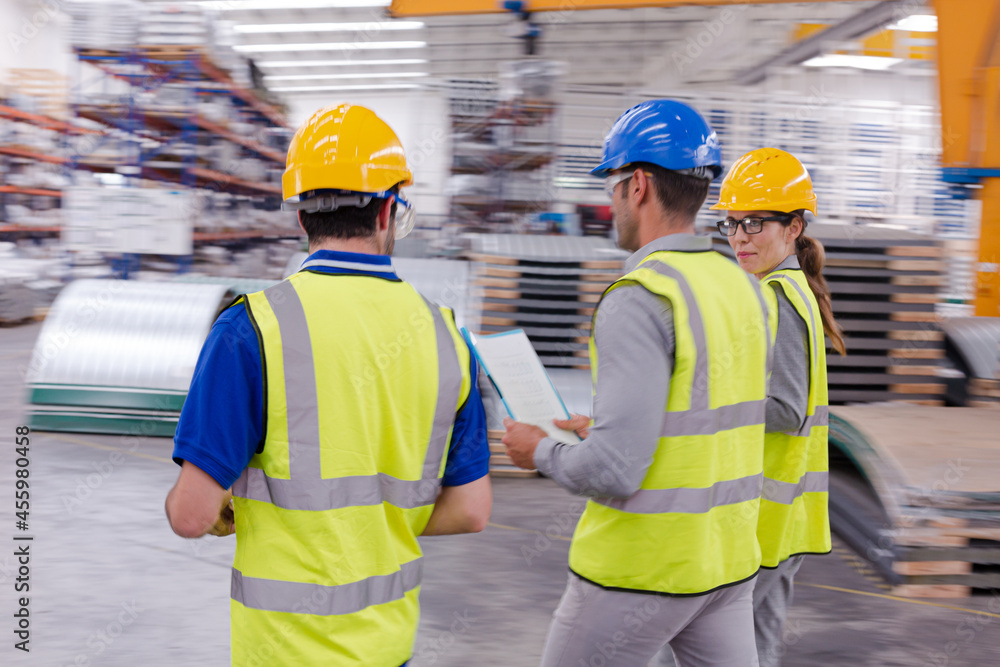 Supervisor and workers talking in warehouse Supervisor and workers talking in warehouse