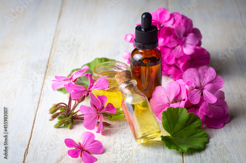 Fresh geranium flower with geranium essential oil, geranium oil