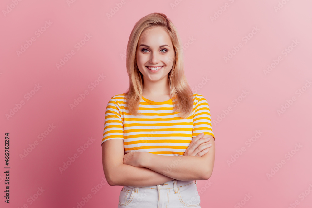 Portrait of self-assured girl folded hands on pink background Portrait of self-assured girl folded hands on pink background