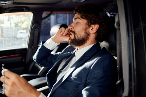 business man in the car talking on the phone passenger © SHOTPRIME STUDIO