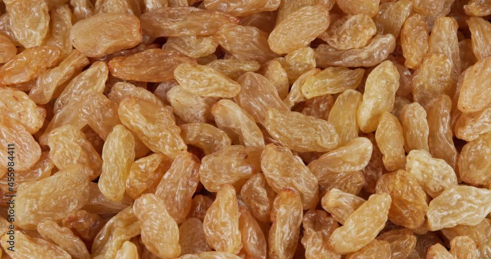 Raisins background rotate slowly. Sweet raisins slow sliding. Close up food background. Gastronomy concept, organic food. Macro fruit dolly shot. Assorted colorful raisins, close up. Raisins background rotate slowly. Sweet raisins slow sliding. Close up food background. Gastronomy concept, organic food. Macro fruit dolly shot. Assorted colorful raisins, close up.