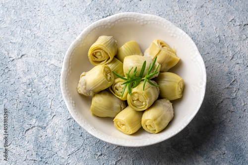 Pickled Artichoke Hearts with Marinated in Plate. photo