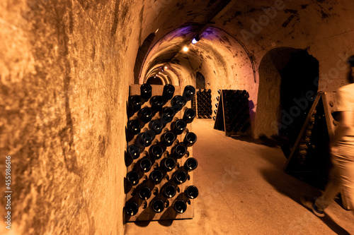 Deep and long undergrounds caves for making champagne sparkling wine from chardonnay and pinor noir grapes in Reims, Champagne, France photo