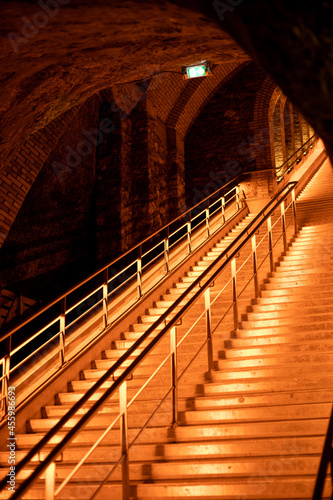 Staircase in deep and long undergrounds caves for making champagne sparkling wine from chardonnay and pinor noir grapes in Reims, Champagne, France