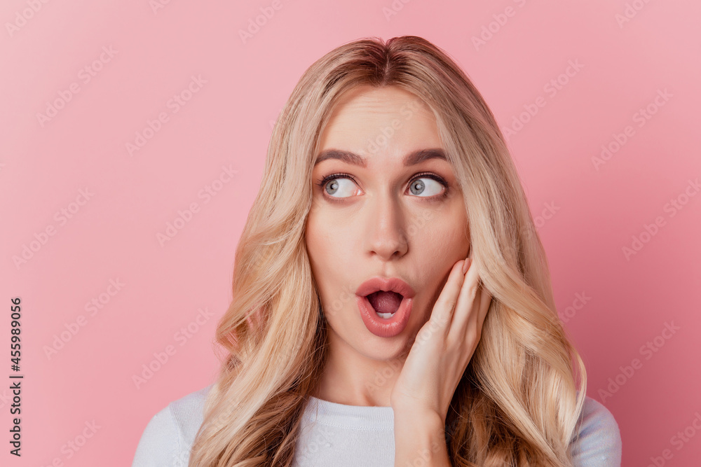 Portrait of shocked funky dreamy girl hand face open mouth look blank space on pink background Portrait of shocked funky dreamy girl hand face open mouth look blank space on pink background