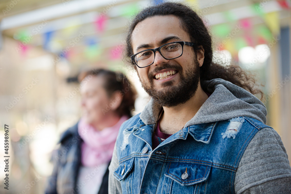Portrait of smiling young man with beard and long hair Portrait of smiling young man with beard and long hair