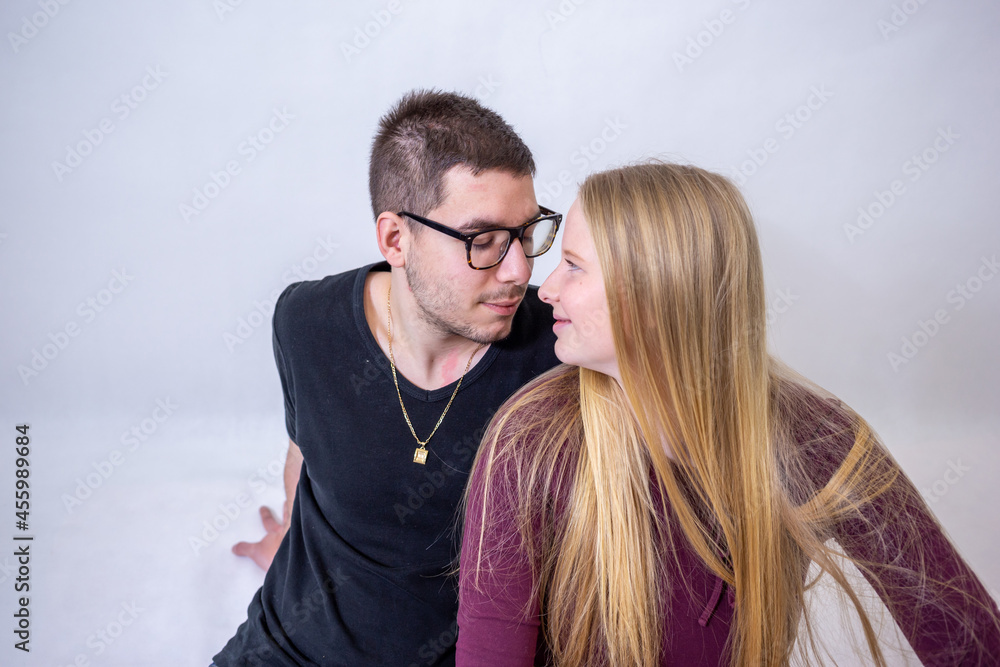 Portrait of young couple on white background