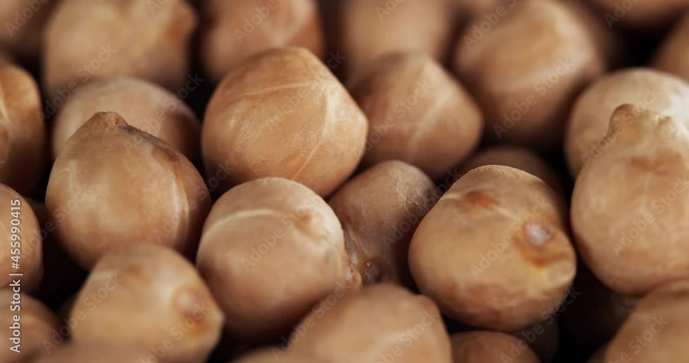 Raw chickpeas, rotation. Chickpeas, close-up dolly shot. Macro footage of chickpeas beans. Food cooking video. Raw chickpeas, rotation. Chickpeas, close-up dolly shot. Macro footage of chickpeas beans. Food cooking video.