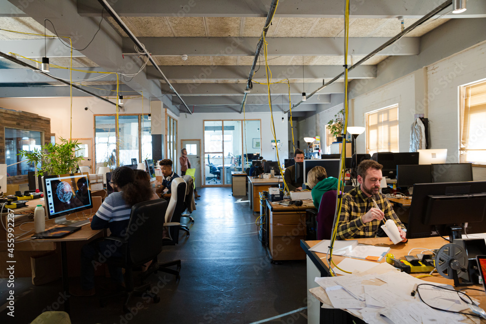 People working in open plan office People working in open plan office