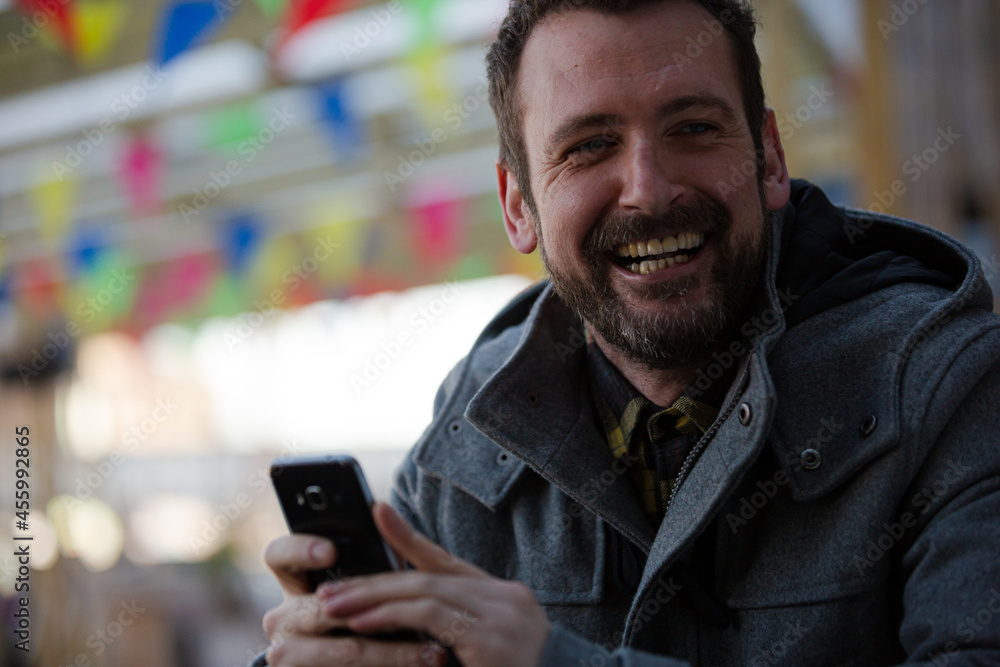 Portrait of smiling man using smartphone Portrait of smiling man using smartphone
