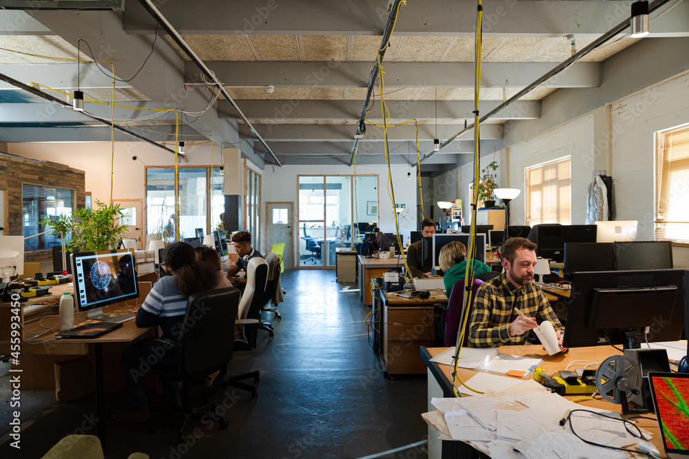 People working in open plan office People working in open plan office