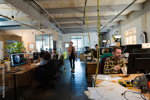 People working in open plan office