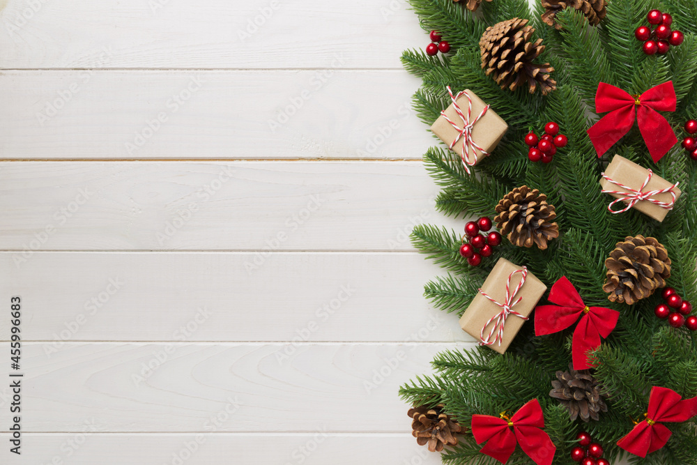 Christmas decorations and fir tree branch and gift boxon dark table. Top view frame with copy space Christmas decorations and fir tree branch and gift boxon dark table. Top view frame with copy space