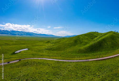 Green grassland and mountain natural landscape in Nalati grassland,Xinjiang,China.Aerial view. photo