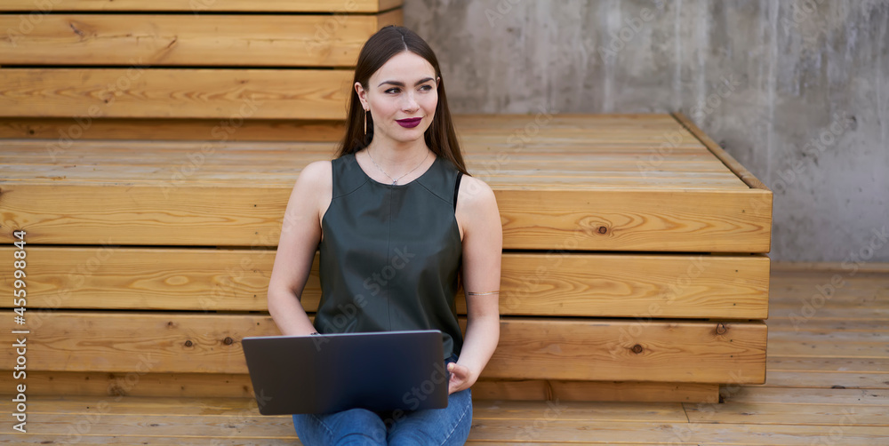 Caucasian pensive female blogger in casual wear thoughtful looking away pondering on idea for publication, millennial skilled woman with laptop computer for remote job rest on urbanity in city Caucasian pensive female blogger in casual wear thoughtful looking away pondering on idea for publication, millennial skilled woman with laptop computer for remote job rest on urbanity in city